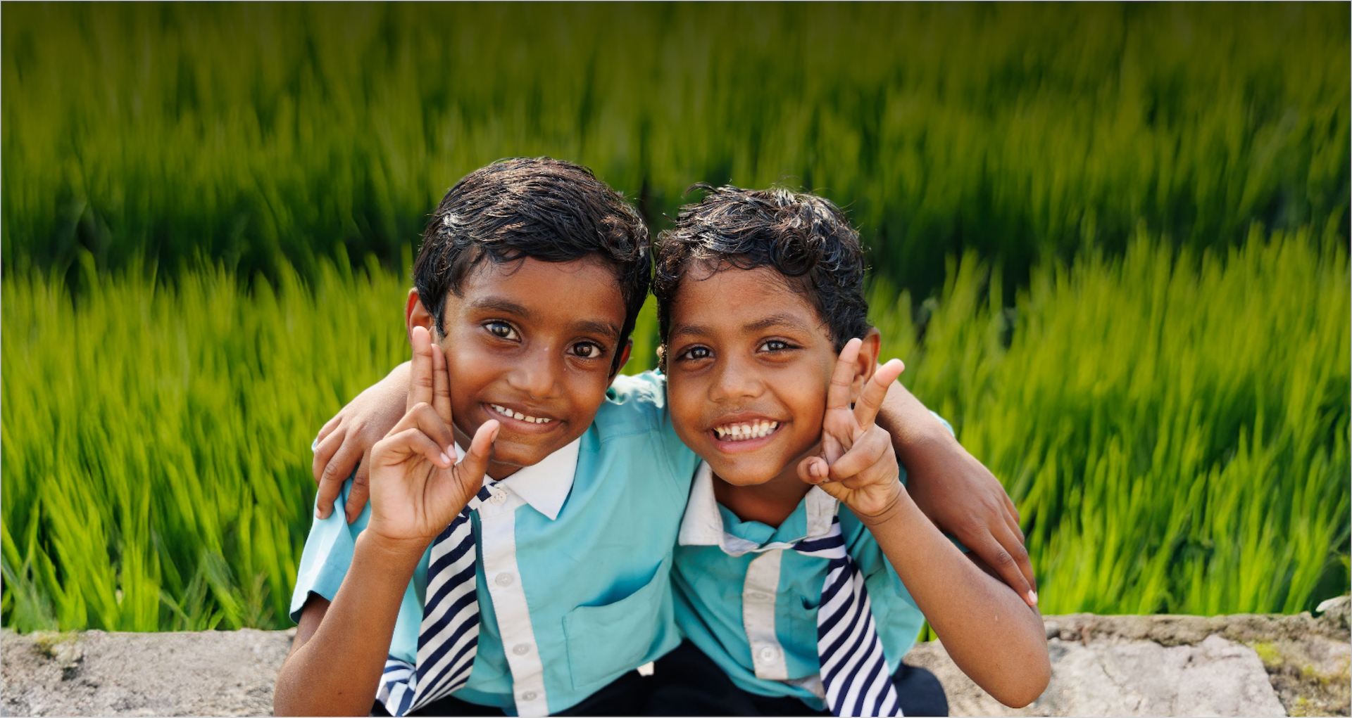 FOREFRONT teacher and students waving in front of FOREFRONT School