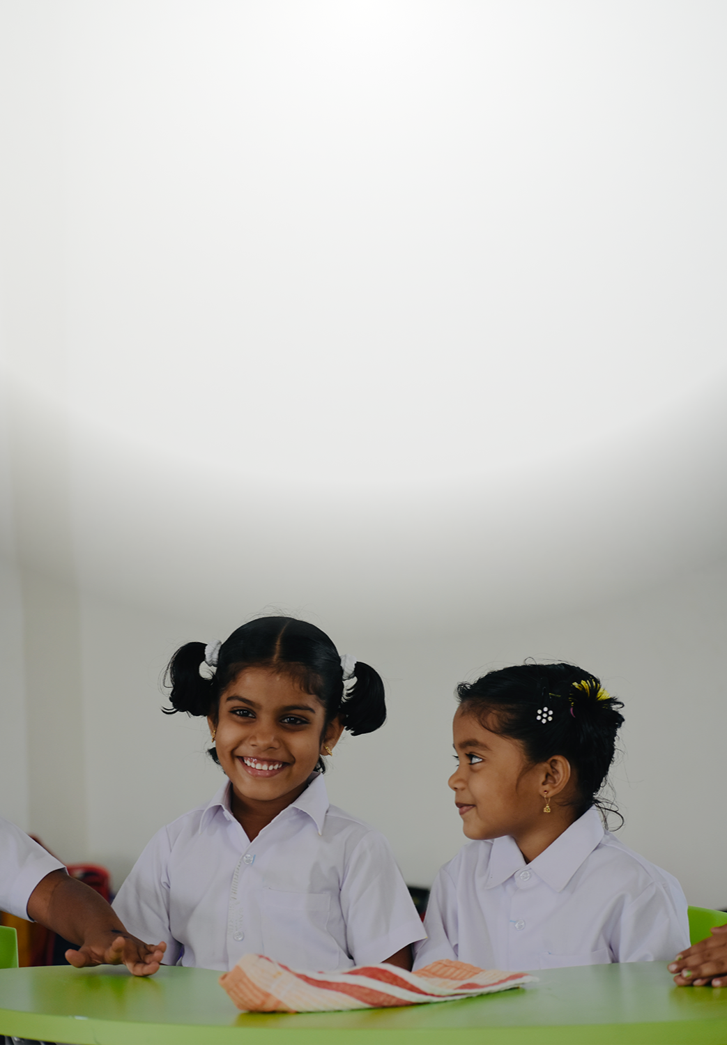 Two young students smiling